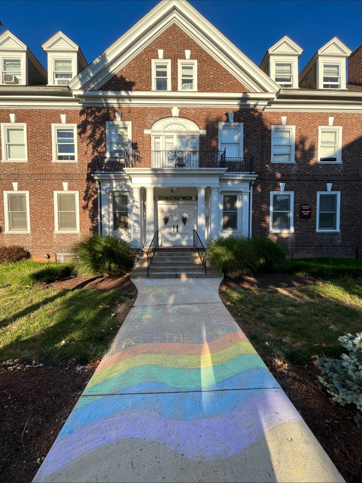 Lavender Lane house at Lafayette College with rainbow chalk walkway